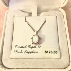 Cute petite oval, pink sapphire turtle pendant set in sterling silver.